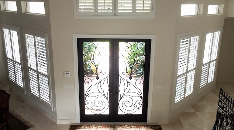 Fort Lauderdale foyer with glass doors and plantation shutters